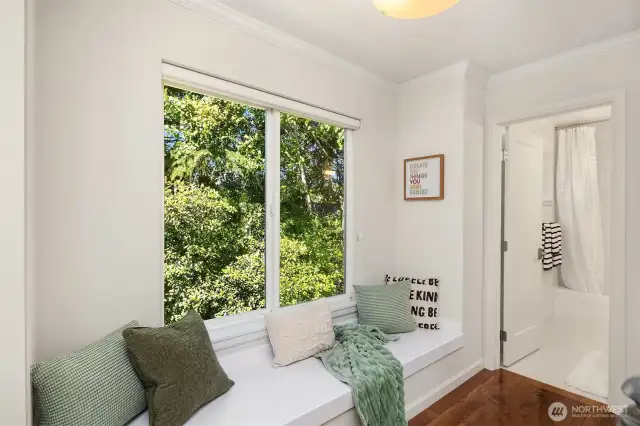 Upstairs offers you a soothing window seat overlooking the treed back yard.