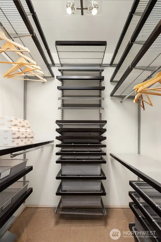 Primary bedroom walk-in closet provides exceptional storage space.