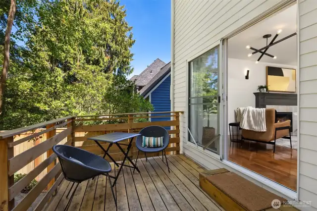 Spacious deck overlooks fenced, private backyard.