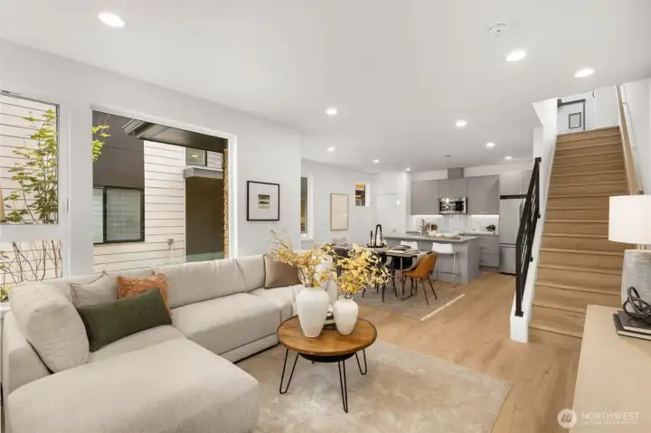 The main floor features a versatile bedroom suite, ideal for guests or a quiet home office setup.