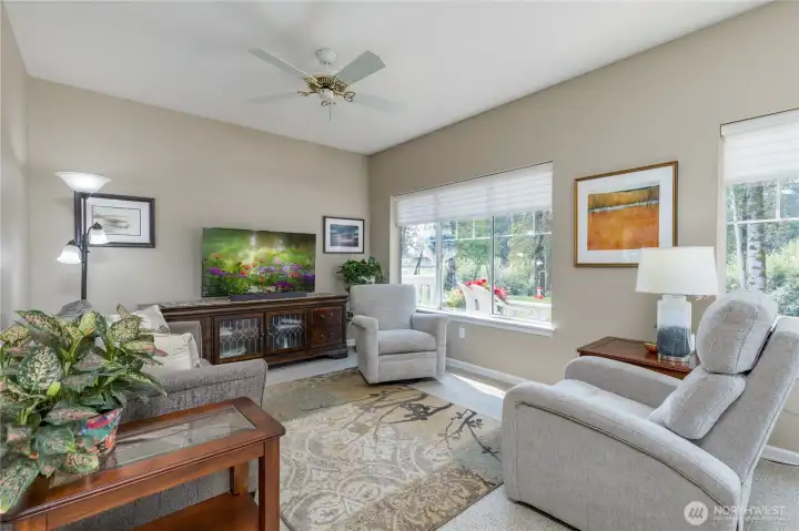 Family room offers a comfortable place to rest while enjoying the natural view