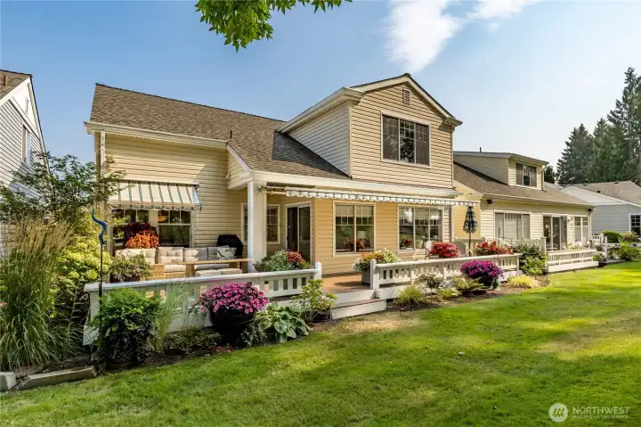 Fantastic outdoor living on this back deck with retractable awnings! HOA maintains roof, siding and landscaping.