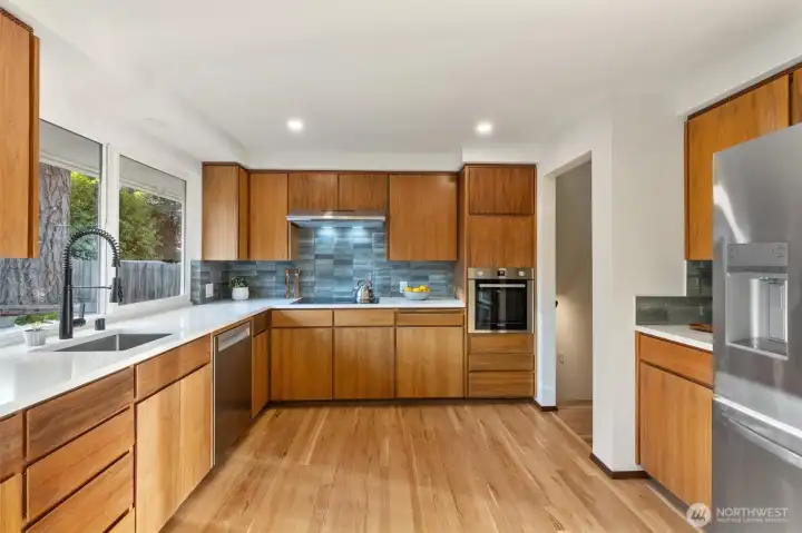 New hardwood floors in kitchen match original floors to perfection!