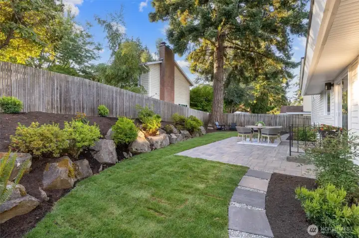 Beautiful landscaped yard with new and mature plantings.