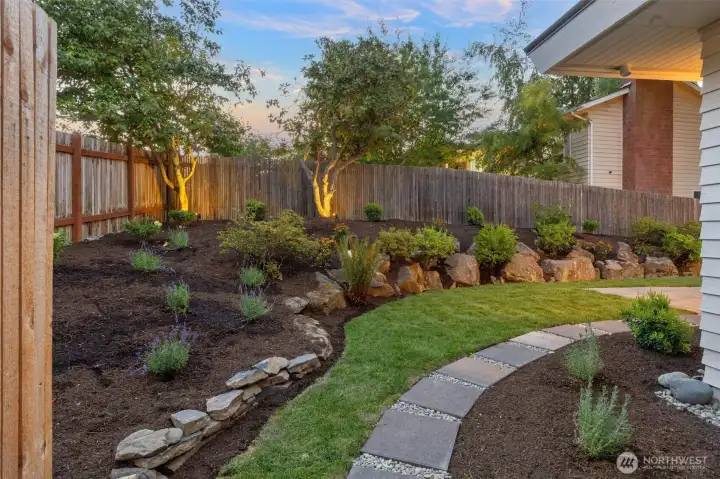 Beautiful landscaped yard with new and mature plantings.