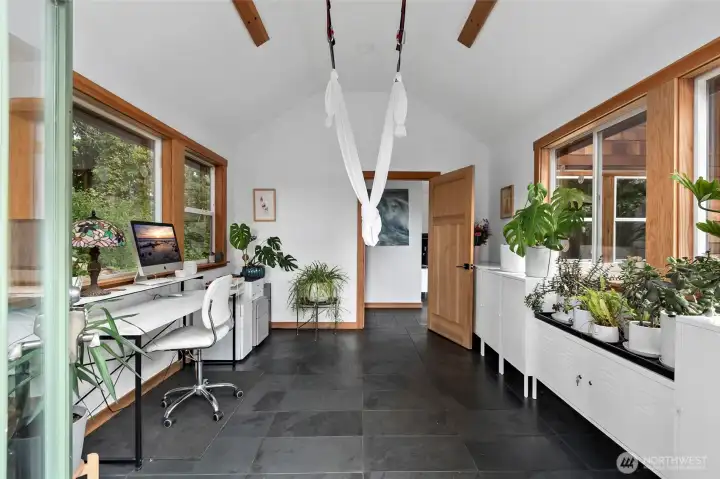 Studio/office space as you walk through the front door of the guest house.