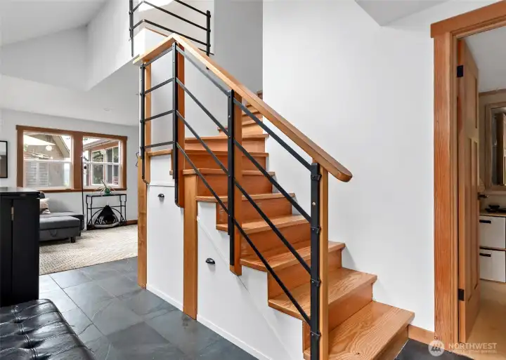 Stairs lead to two rooms on second level of the guest house.