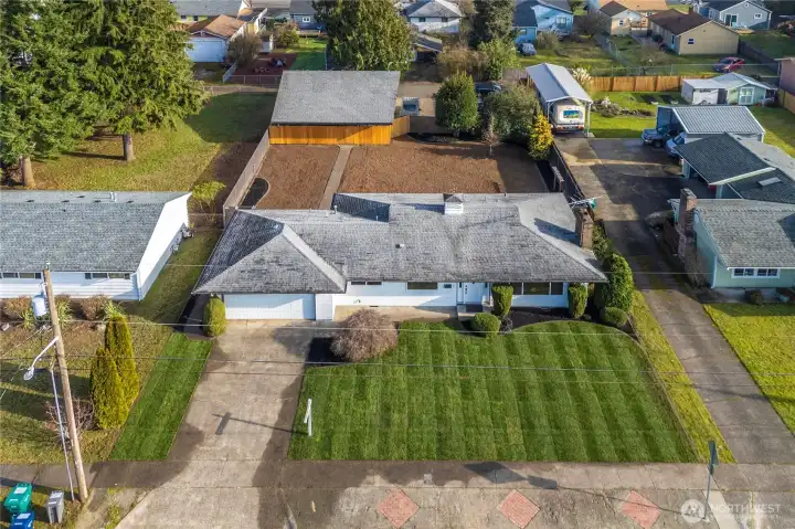 Large lot size with back-alley access to the detached 34'x30' commercial quality shop.