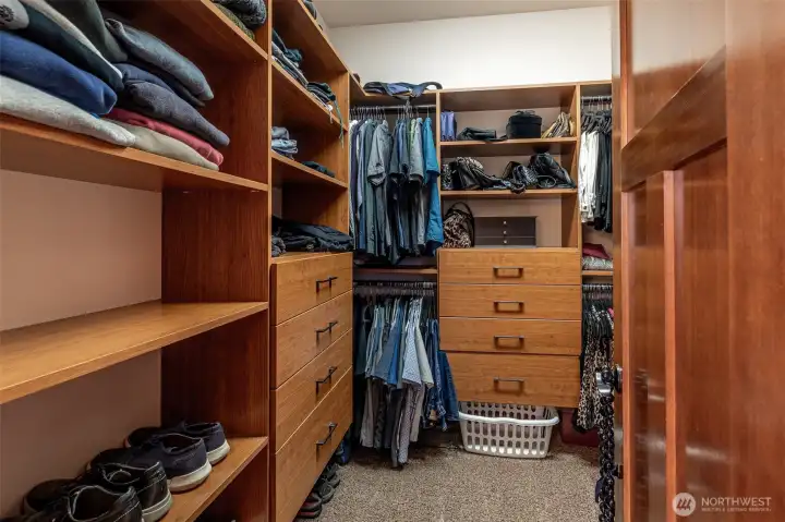 Primary bedroom custom built in walk in closet