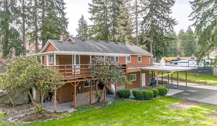 One story home with basement is ideal for the huge entertainment deck with stairs leading to the backyard carport.