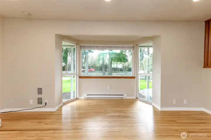 Natural light floods the living area and provides beautiful views of your front yard and mature landscaping.