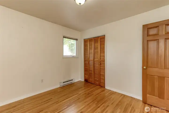 Both the second and third bedrooms have solid wood doors and wood closet doors. Windows overlooking the backyard.