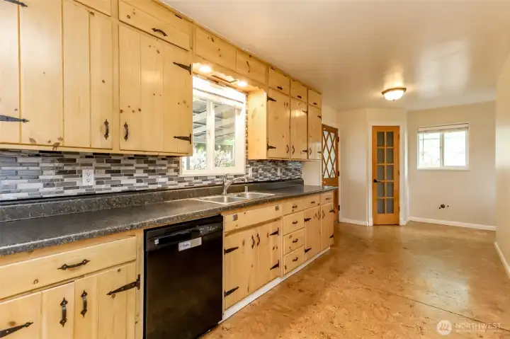 Beautiful pine cabinetry in the kitchen with storage that reaches the ceiling! Check out the lighted walk in pantry too!