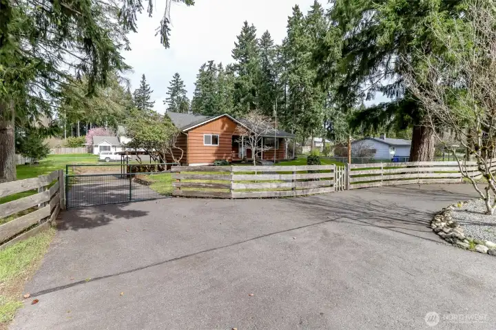 Gated entrance and beautiful paved driveway!