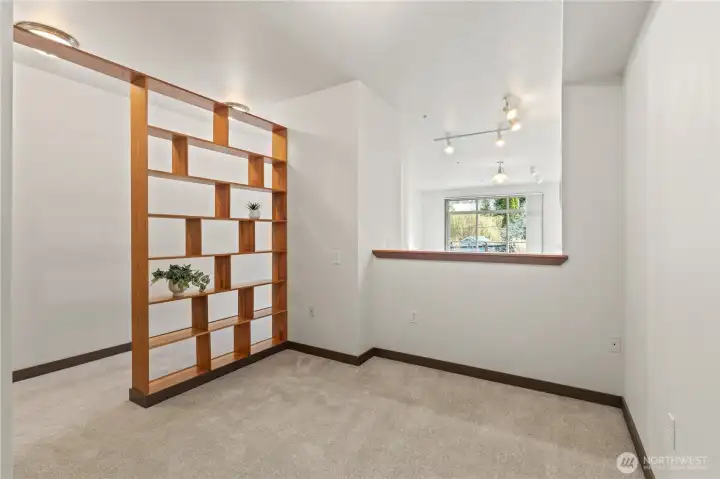 Bedroom area with shelving for privacy and decorations