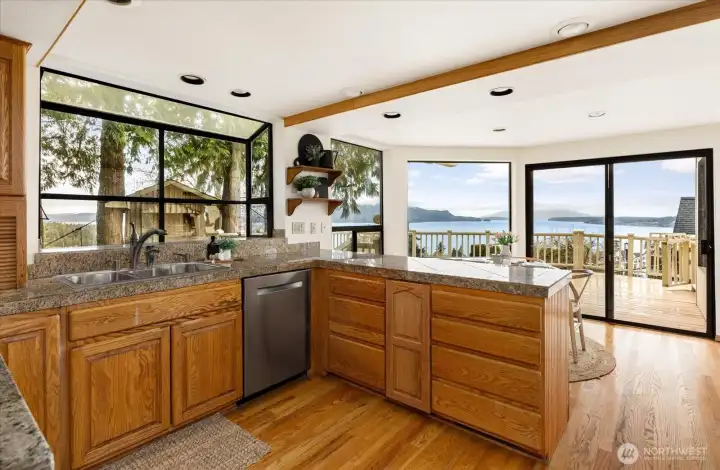 Kitchen with bay window overlooking backyard and views of the bay