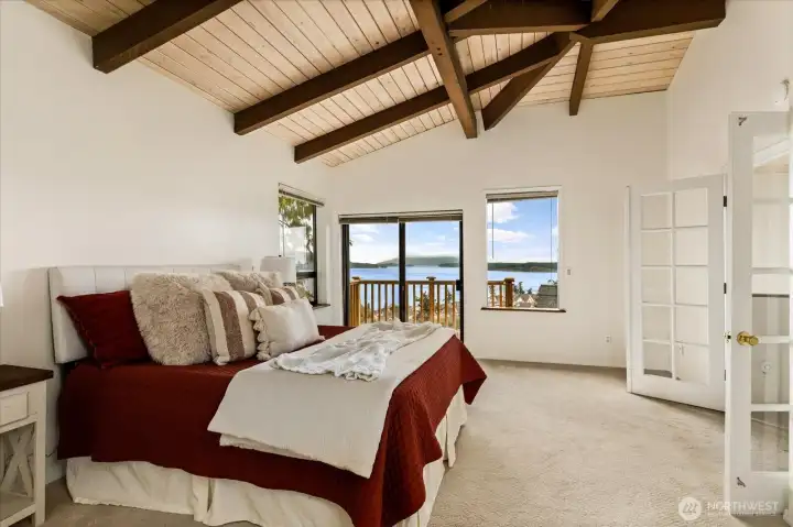 Large primary suite with private deck and bay views