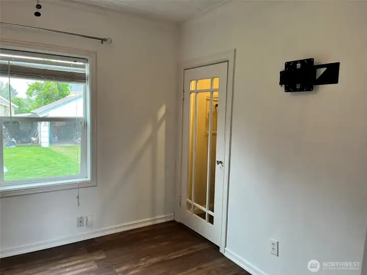 Primary bedroom with glass closet door and glass knob