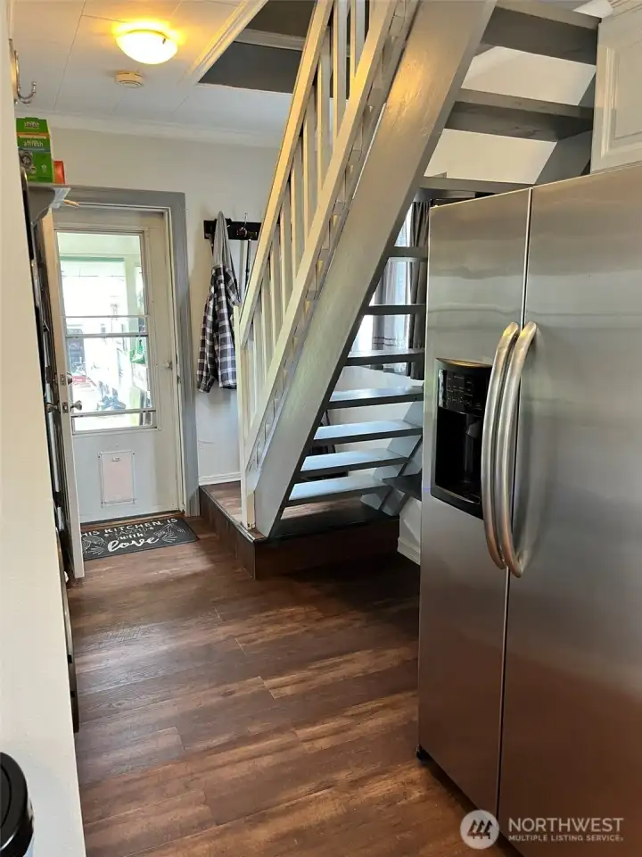 Laundry/stairs/back door  off kitchen