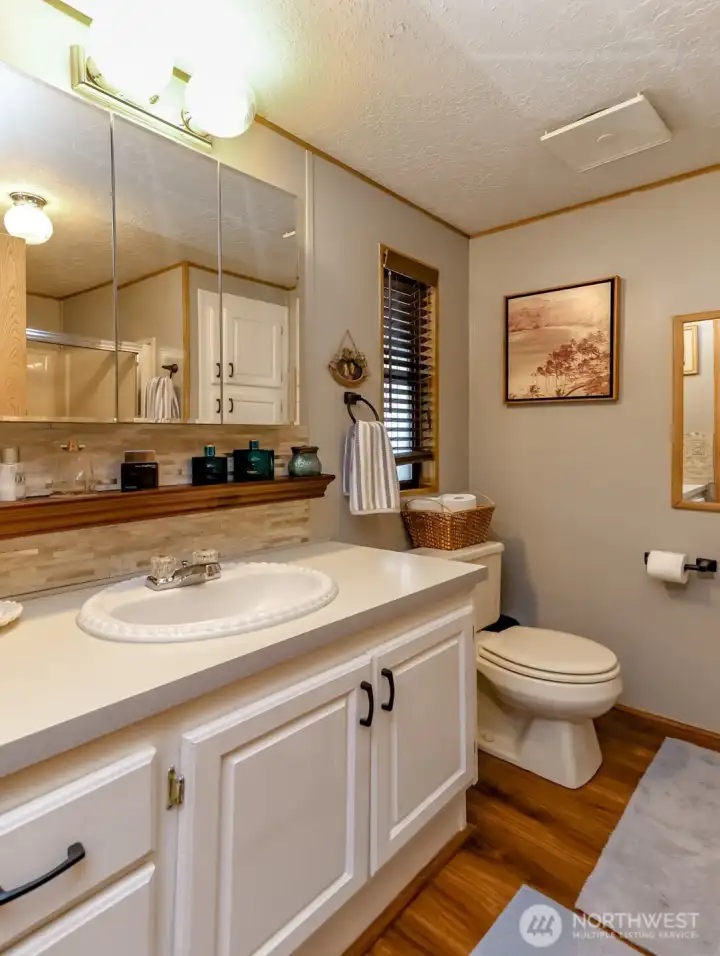 Primary bathroom, shower in next frame
