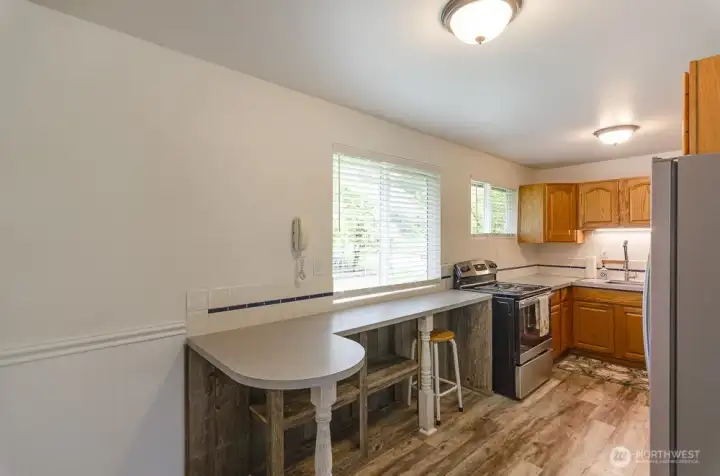 Added open storage under counter space.  Two windows add natural light.