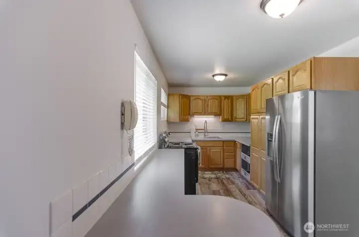 Newer cabinetry and appliances.  Counterspace plus eating island.