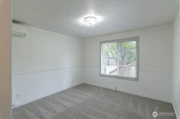 Bedroom 2 overlooks the back yard and also has it's own ductless mini split.  Brand new blinds throughout.