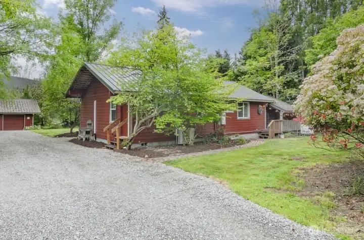 Front of the home.  Entry on the right leads to covered entry and door to the kitchen.