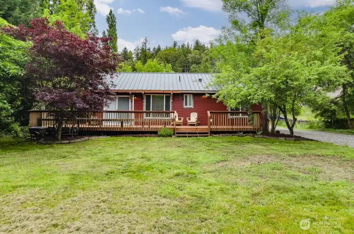 Surrounded by nature.  Welcome home to  your own private paradise.  Newly installed deck.  Easy care metal roof.