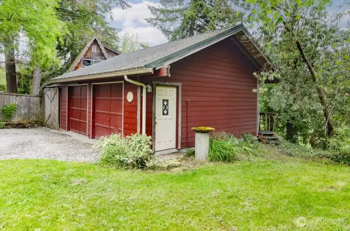 2 car garage plus additional storage on side for wood storage or lawn equipment.   The steps on the back side lead to viewing deck of the Deschutes river.