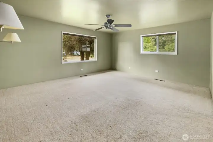 Spacious bedroom filled with natural light and plenty of room to unwind.