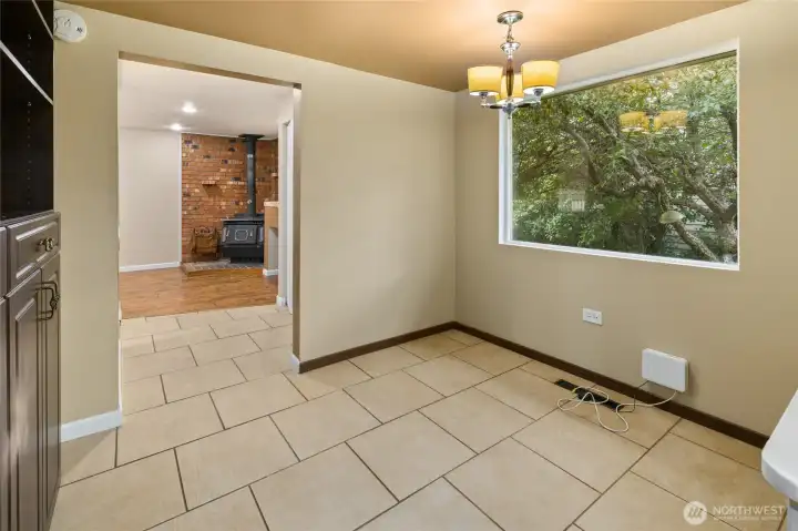 Versatile flex space ready to serve as a home office, art studio, playroom, or expanded dining.