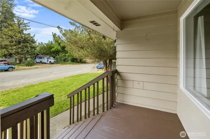 Charming front deck creates a warm welcome for guests and everyday enjoyment.