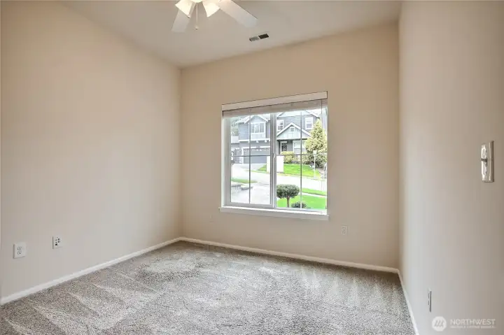 Main level bedroom. Perfect for guests or as office space. Main level bedroom. Perfect for guests or as office space.