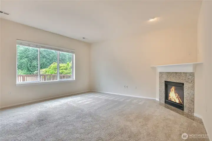 Main level living room with fireplace. Main level living room with fireplace.
