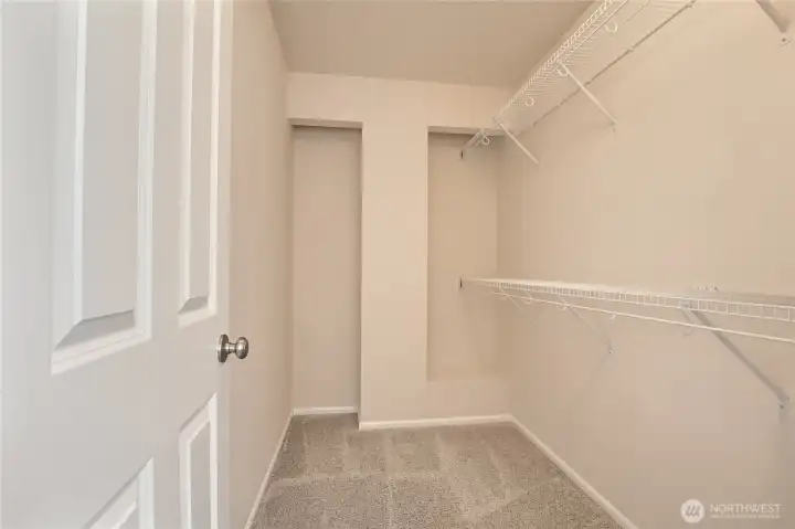 Walk in closet attached to primary bathroom. Walk in closet attached to primary bathroom.