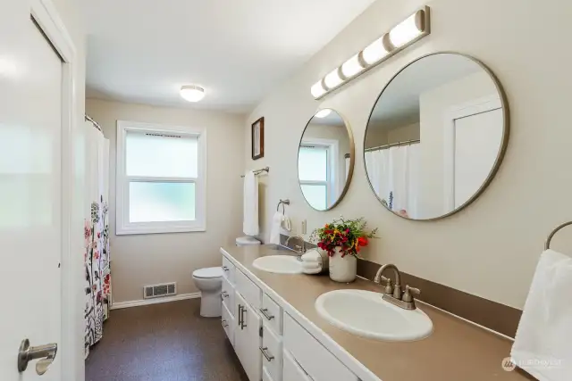 Second full bathroom on the main floor services the other bedrooms.