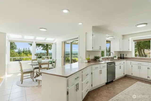 Tons of cabinet space in the kitchen and informal dining area with epic views.