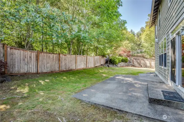 Fully-fenced yard has mature trees and no neighbors behind!