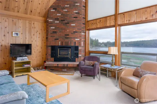 Great room with woodstove and water views