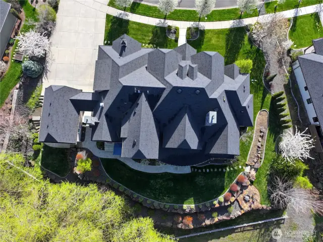 Top View of the home with Rock terracing to the Greenbelt behind