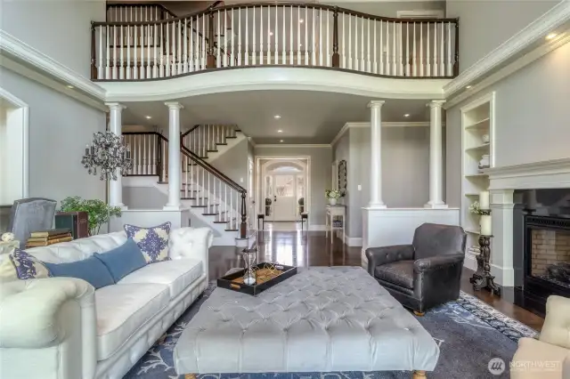 Spectacular stairway with open balcony to second & third floors