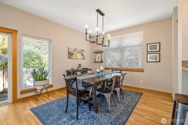 Beautiful light fixture adds a shining touch to this spacious dining room.