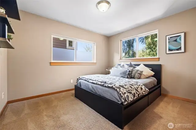 Spacious second-floor corner bedroom (#2) with views.