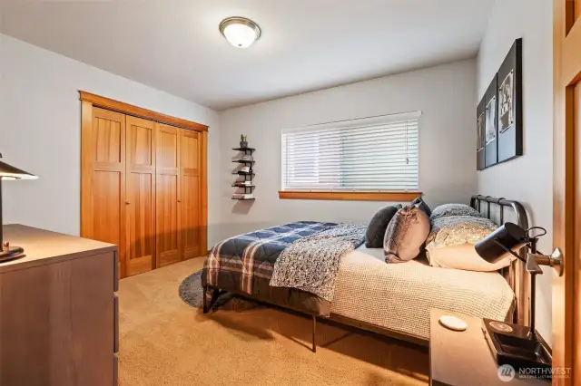 Conveniently located across the hall from the full bath, this spacious (#4) bedroom features the same natural wood and carpet found on the second floor.