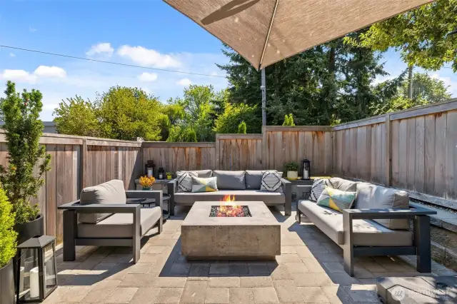 Capitalizing on the southern exposure, the homeowner created this private outdoor sanctuary with a custom paver patio and cedar fence.