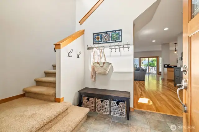 The vaulted entry is flooded with natural light.