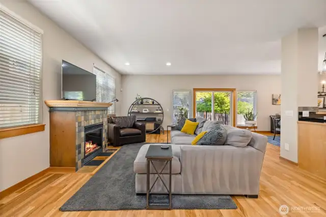 The gas fireplace anchors the expansive double-length living room.