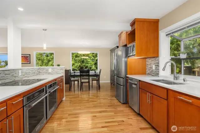 Beautiful chef's kitchen with expansive countertops and double ovens.