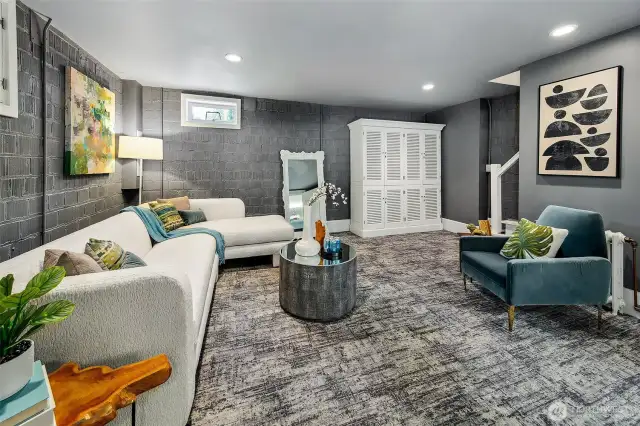 Tucked quietly below, this flexible lower-level suite offers retreat and versatility—perfect for movie nights, extended guests, or creative pursuits. With its own full bath and separate entrance, it’s a private refuge within a home already cradled by nature.